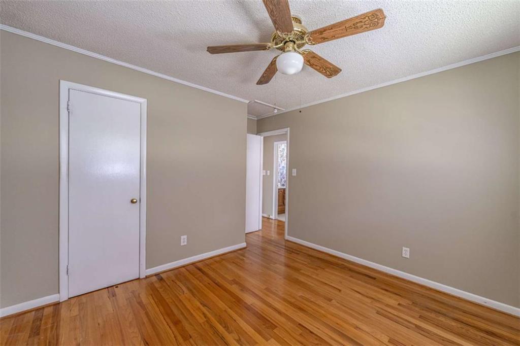 135 Benton Drive Northwest Rome, GA 30165 - Photo 11 of 16 a view of an empty room with wooden floor