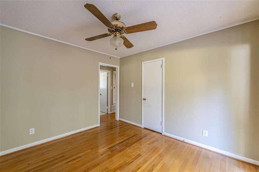 135 Benton Drive Northwest Rome, GA 30165 - Photo 14 of 16 a view of a livingroom with a ceiling fan and wooden floor