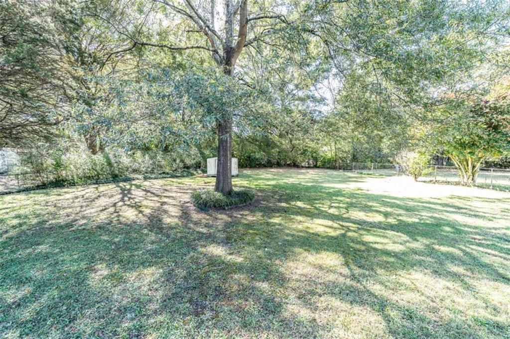 135 Benton Drive Northwest Rome, GA 30165 - Photo 3 of 16 a view of a field with a tree