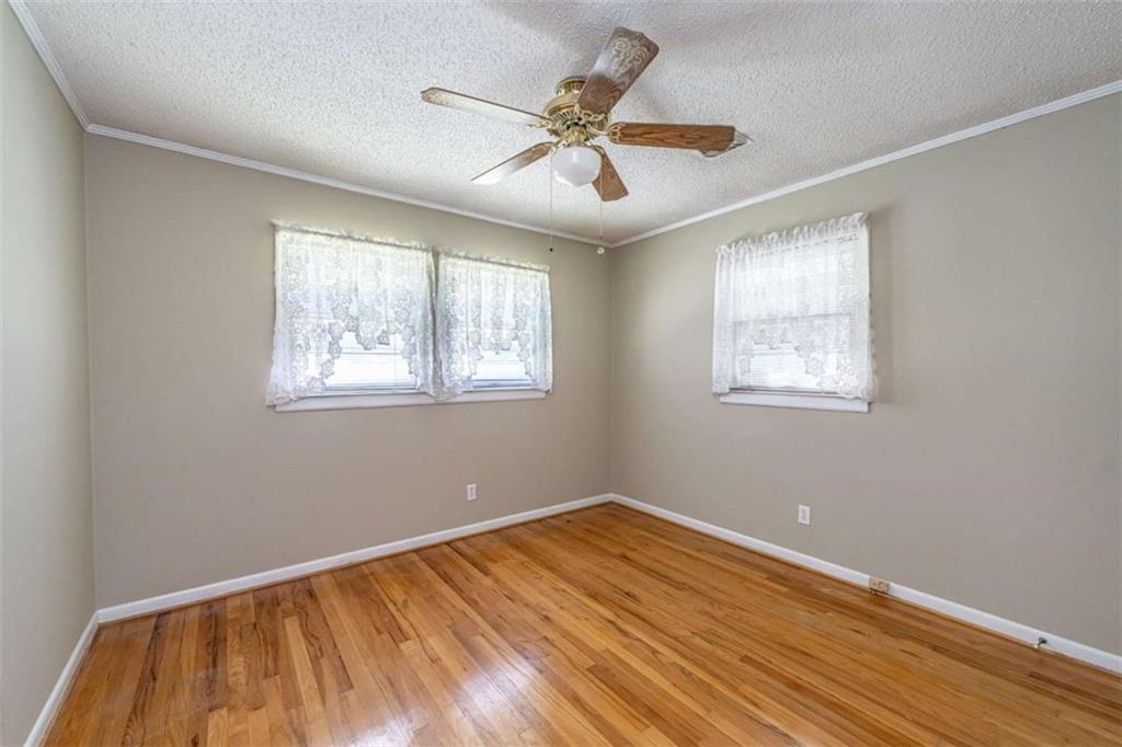 135 Benton Drive Northwest Rome, GA 30165 - Photo 10 of 16 a view of a room with wooden floor and windows
