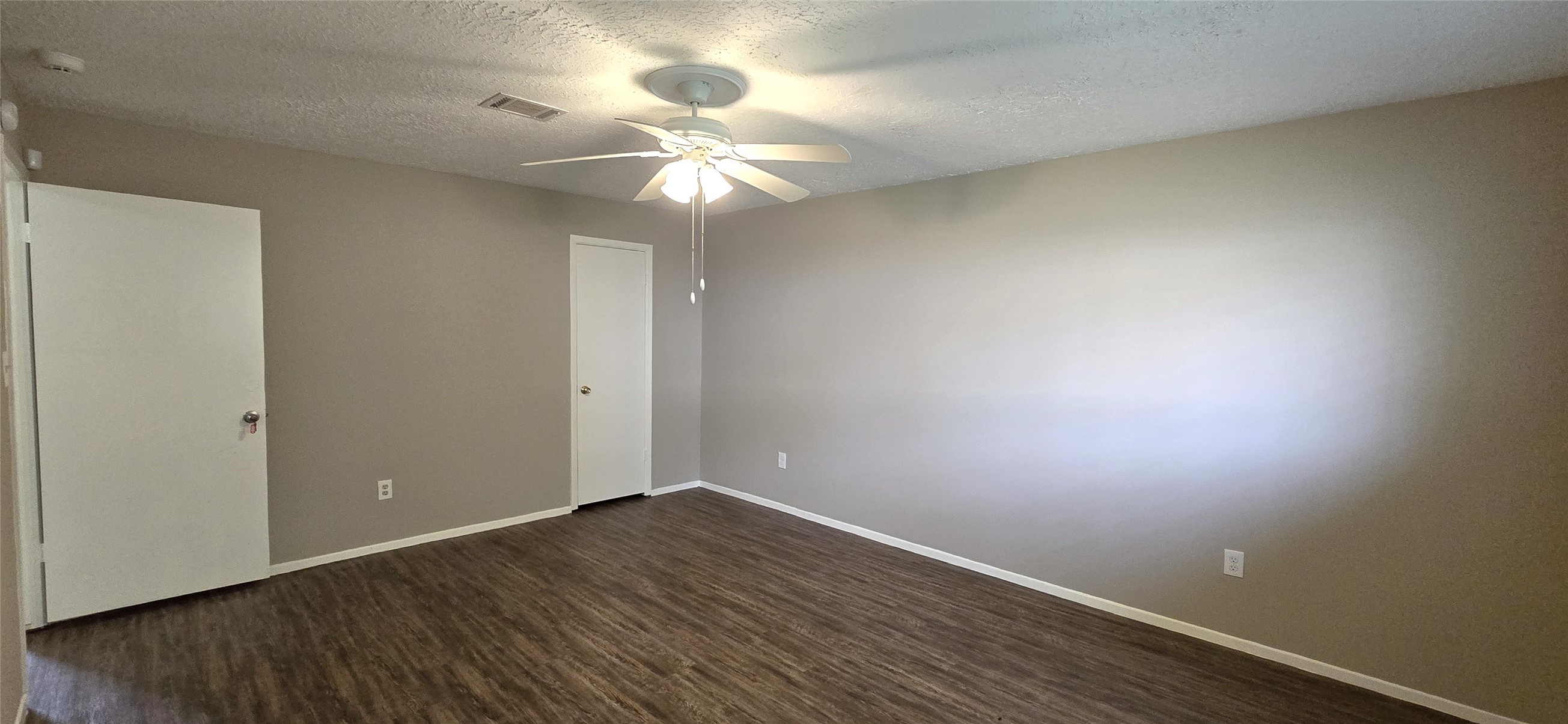 23019 Tree Bright Lane Spring, TX 77373 - Photo 16 of 20 Another view of the primary bedroom. Walk-in closet on the right. Door to hallway on left.