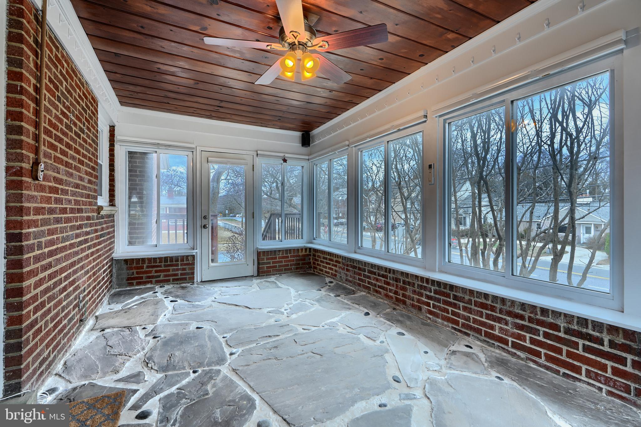 9715 Saxony Road Silver Spring, MD 20910 - Photo 12 of 31 a view of a porch with wooden floor