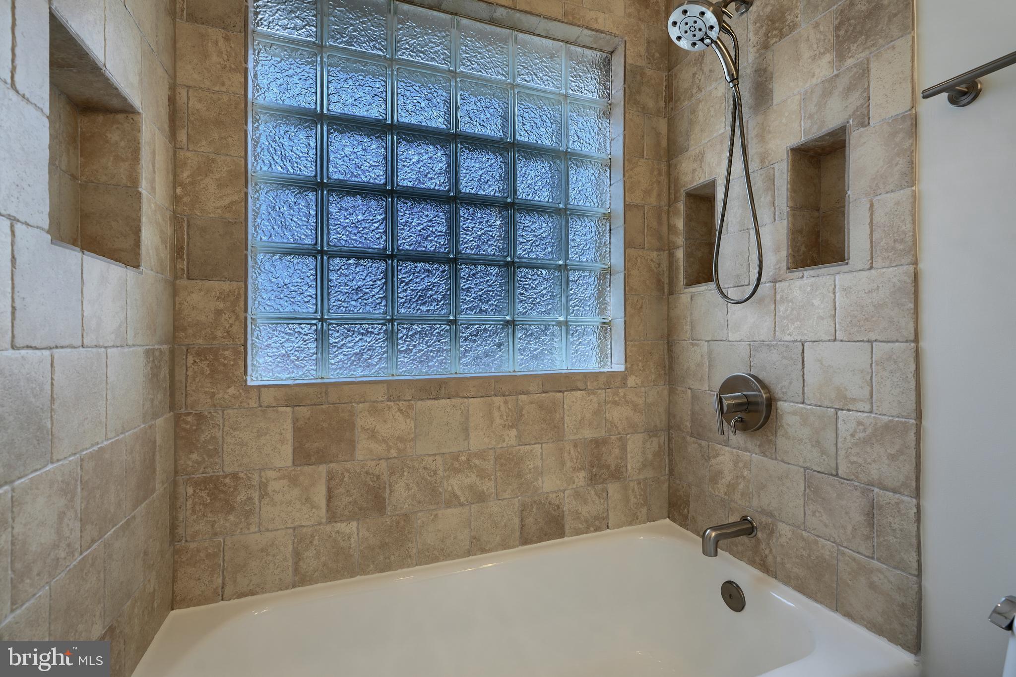 9715 Saxony Road Silver Spring, MD 20910 - Photo 16 of 31 a bathroom with a bathtub