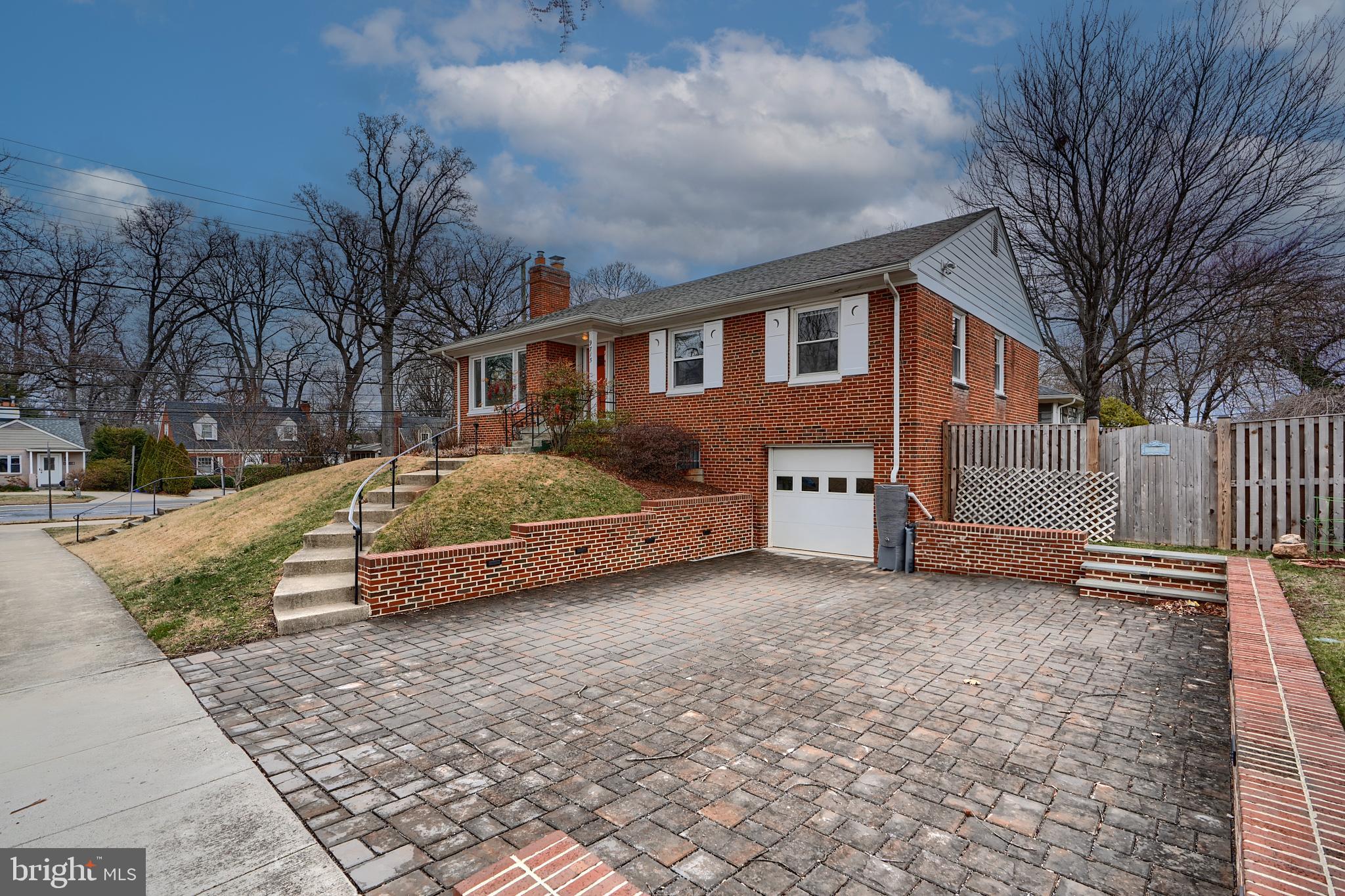 9715 Saxony Road Silver Spring, MD 20910 - Photo 2 of 31 a view of a house with a yard covered in snow