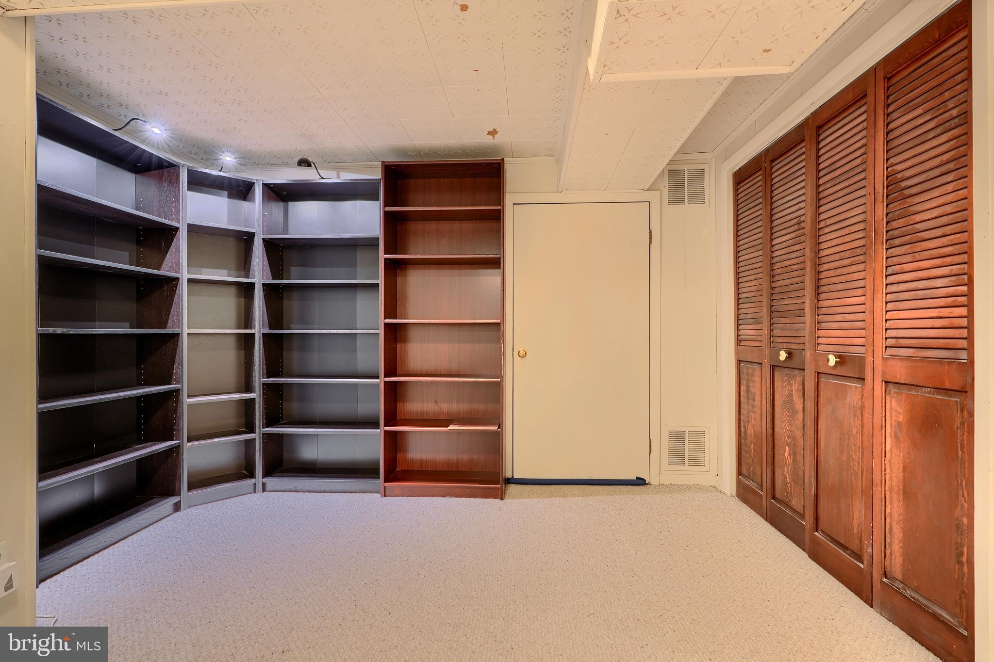 9715 Saxony Road Silver Spring, MD 20910 - Photo 21 of 31 a view of an empty room with empty shelves