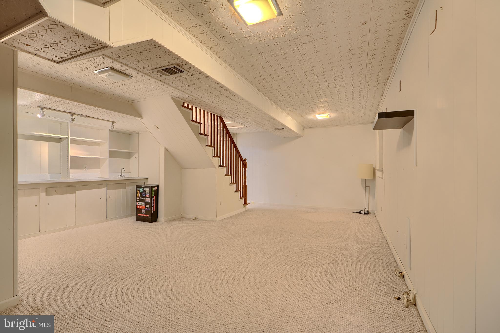 9715 Saxony Road Silver Spring, MD 20910 - Photo 22 of 31 a view of a big room with closet and windows