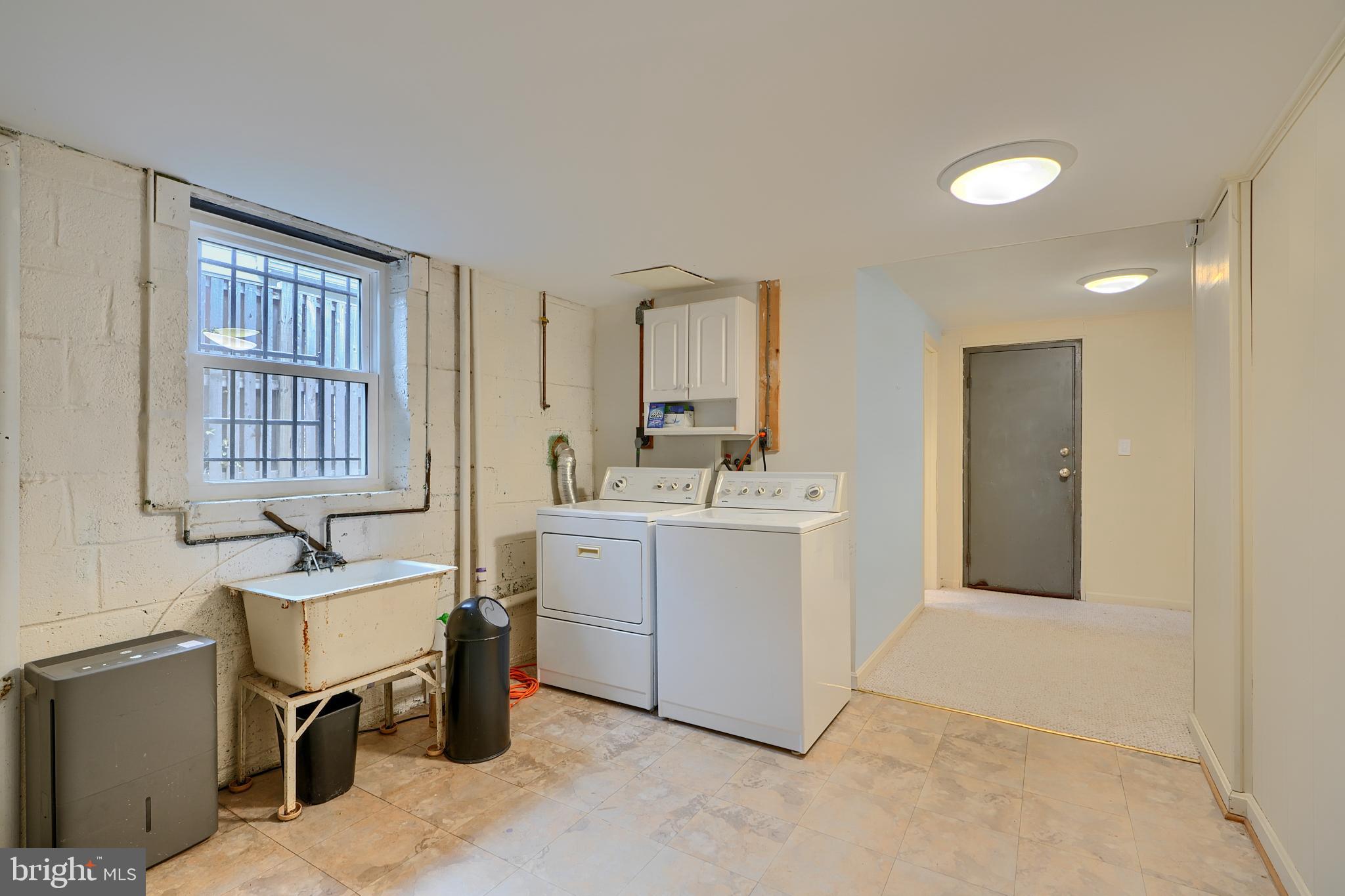 9715 Saxony Road Silver Spring, MD 20910 - Photo 25 of 31 a room with a sink and a chair