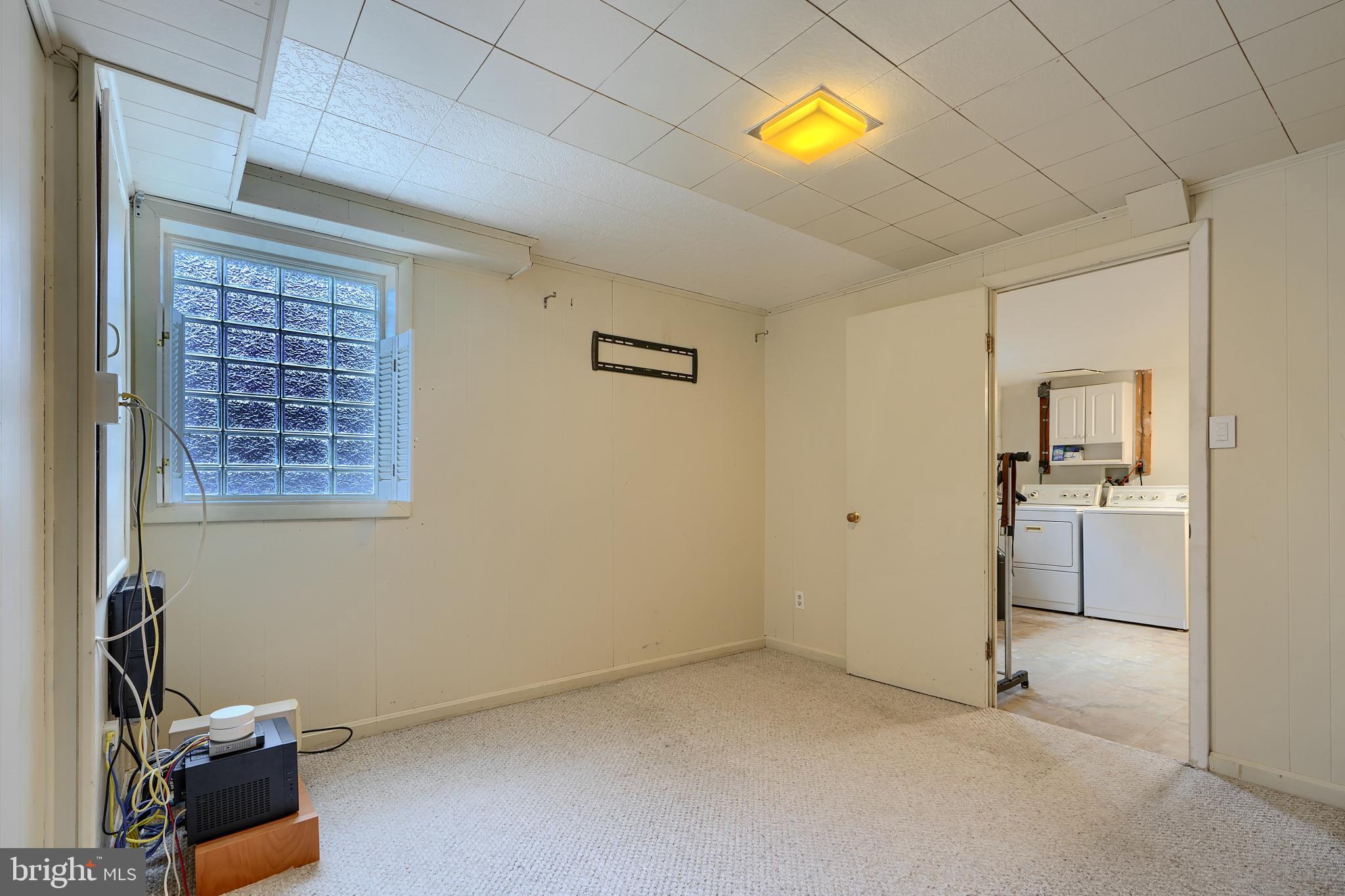 9715 Saxony Road Silver Spring, MD 20910 - Photo 27 of 31 a view of empty room with a window and kitchen view