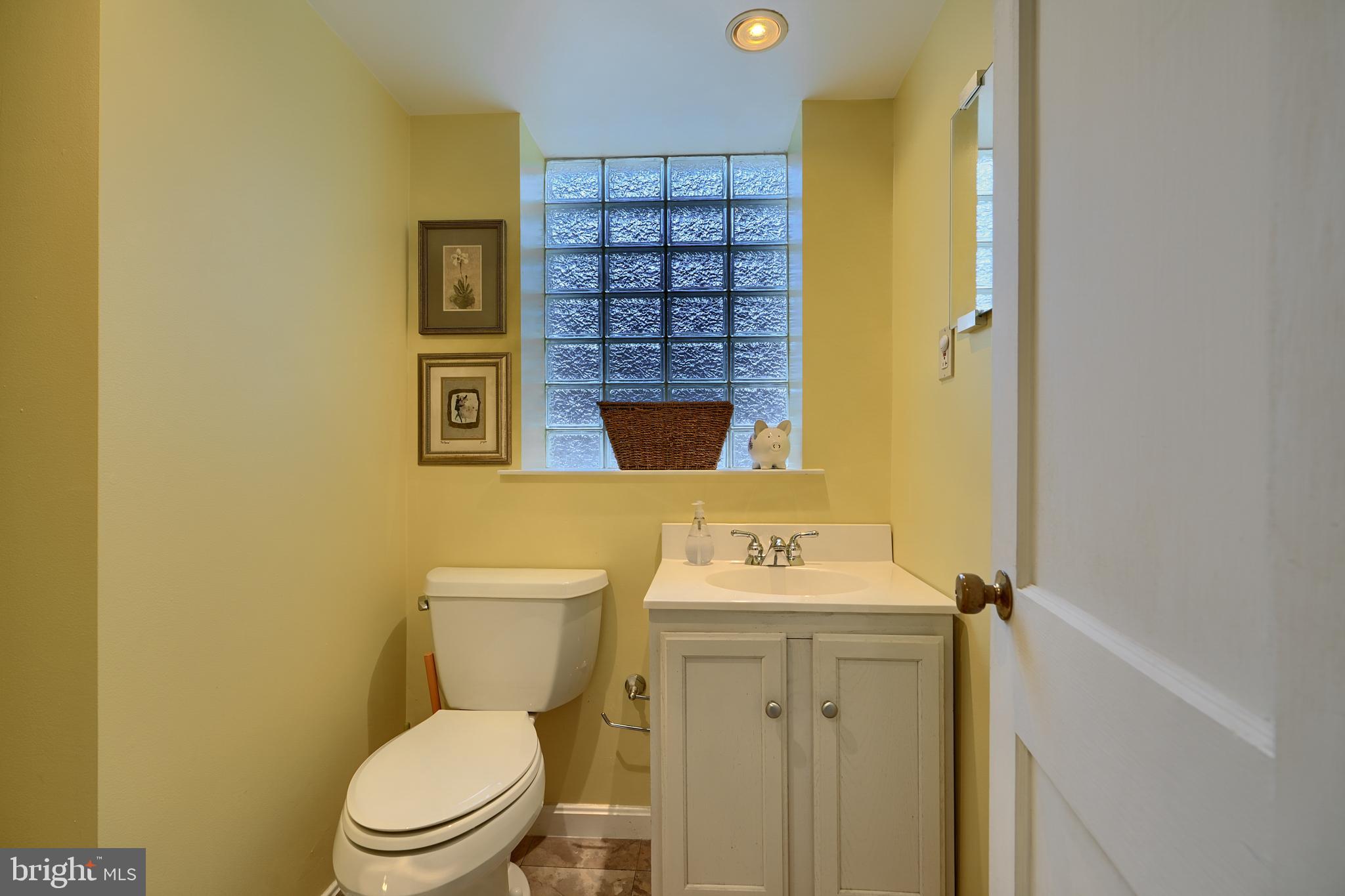 9715 Saxony Road Silver Spring, MD 20910 - Photo 28 of 31 a bathroom with a sink and a toilet