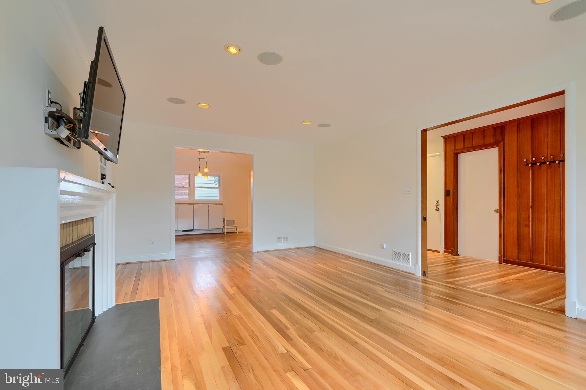 9715 Saxony Road Silver Spring, MD 20910 - Photo 7 of 31 a view of empty room with wooden floor and fan