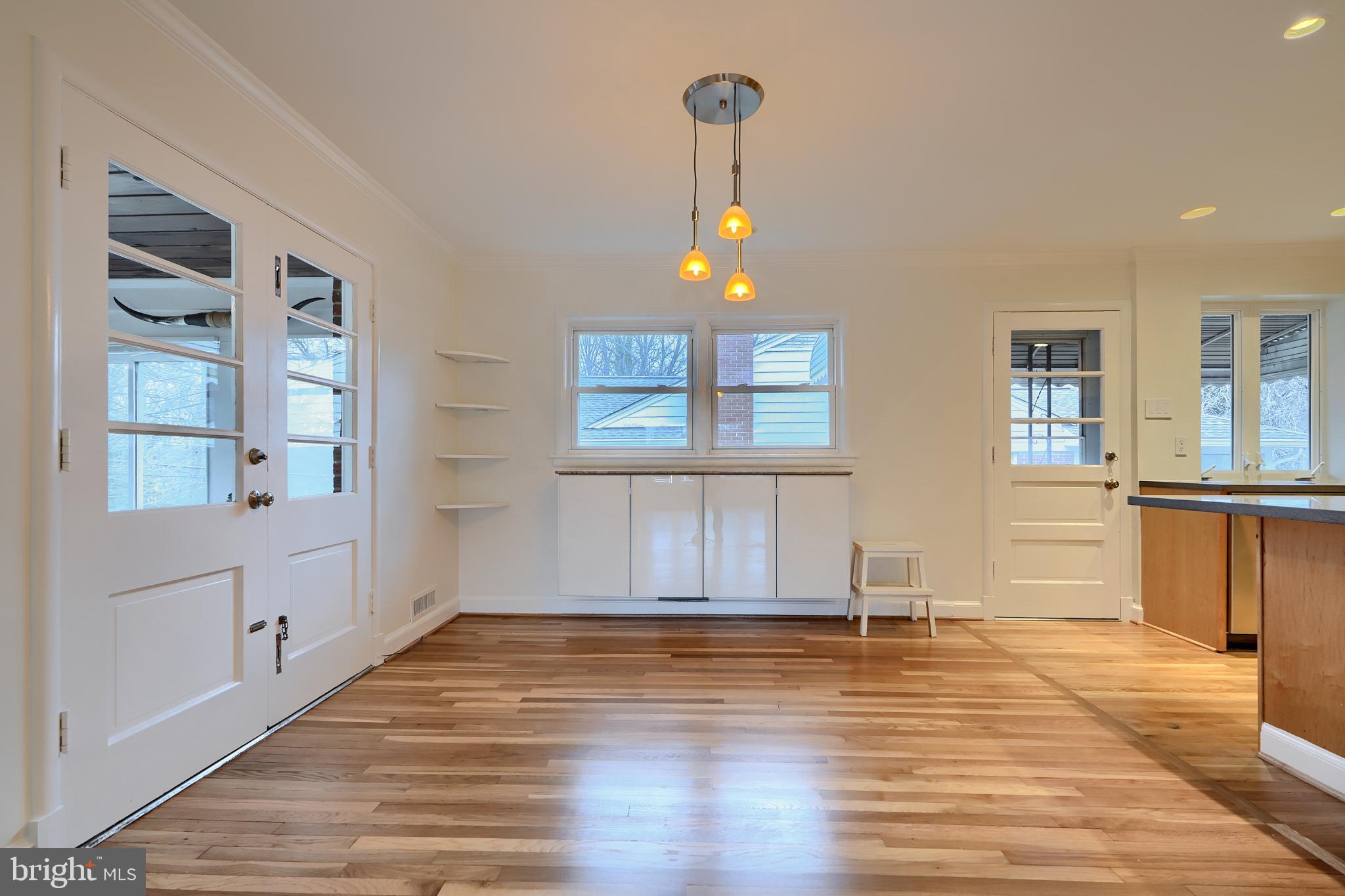 9715 Saxony Road Silver Spring, MD 20910 - Photo 8 of 31 a view of empty room with kitchen and window