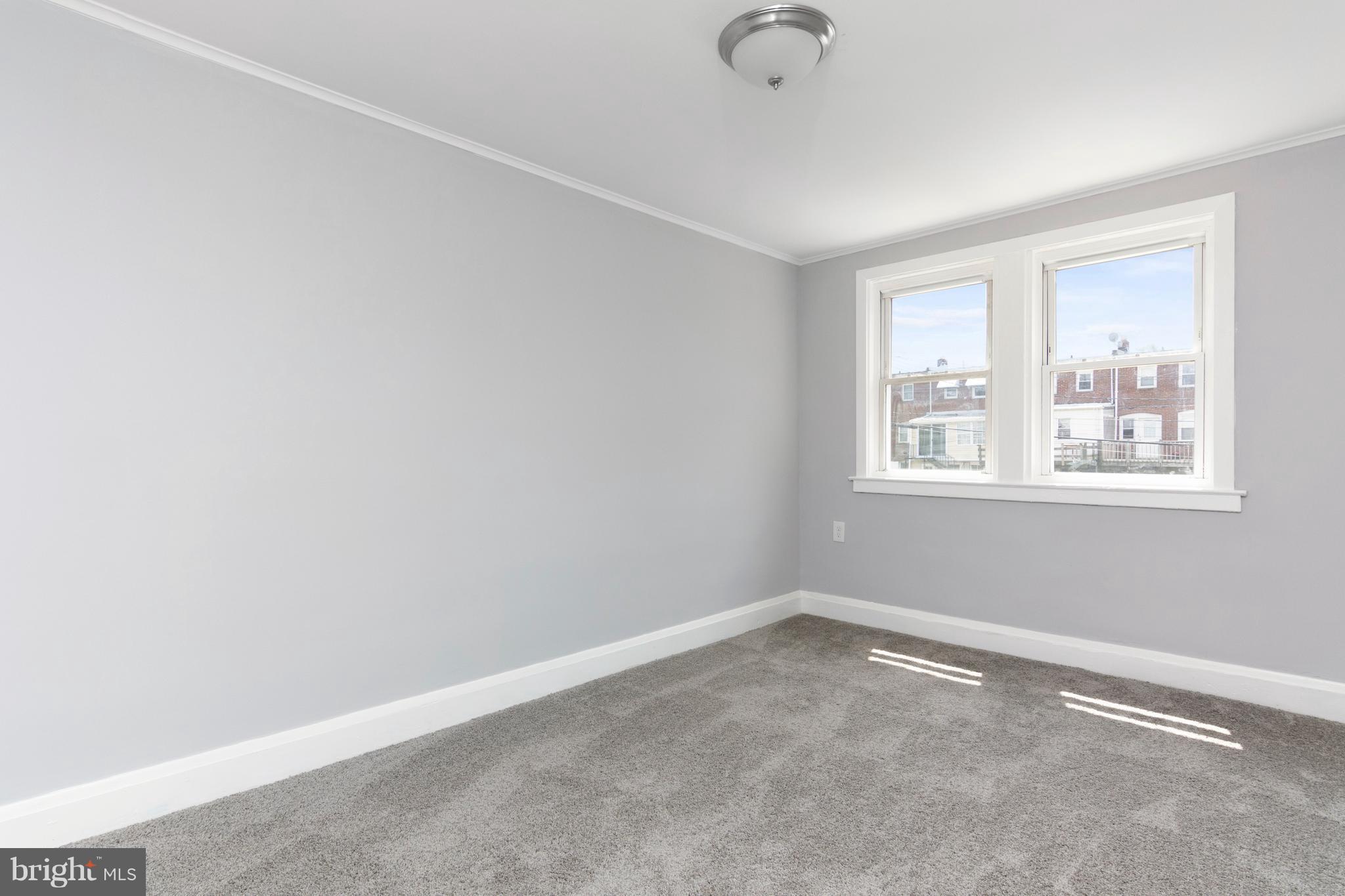 209 West Meadow Road Baltimore, MD 21225 - Photo 14 of 29 an empty room with windows