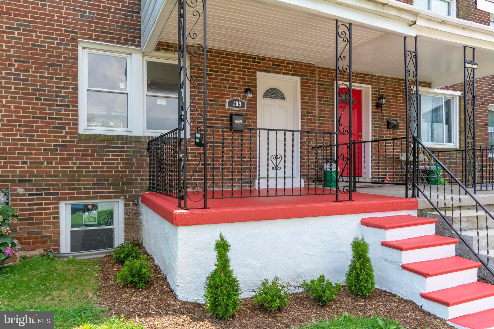 209 West Meadow Road Baltimore, MD 21225 - Photo 3 of 29 a backyard of a house with seating space