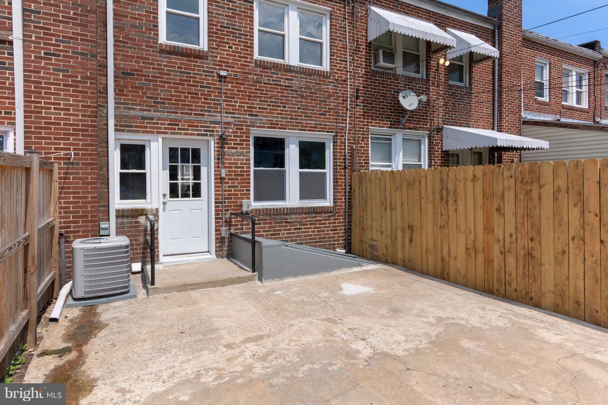 209 West Meadow Road Baltimore, MD 21225 - Photo 26 of 29 a view of a house with a yard