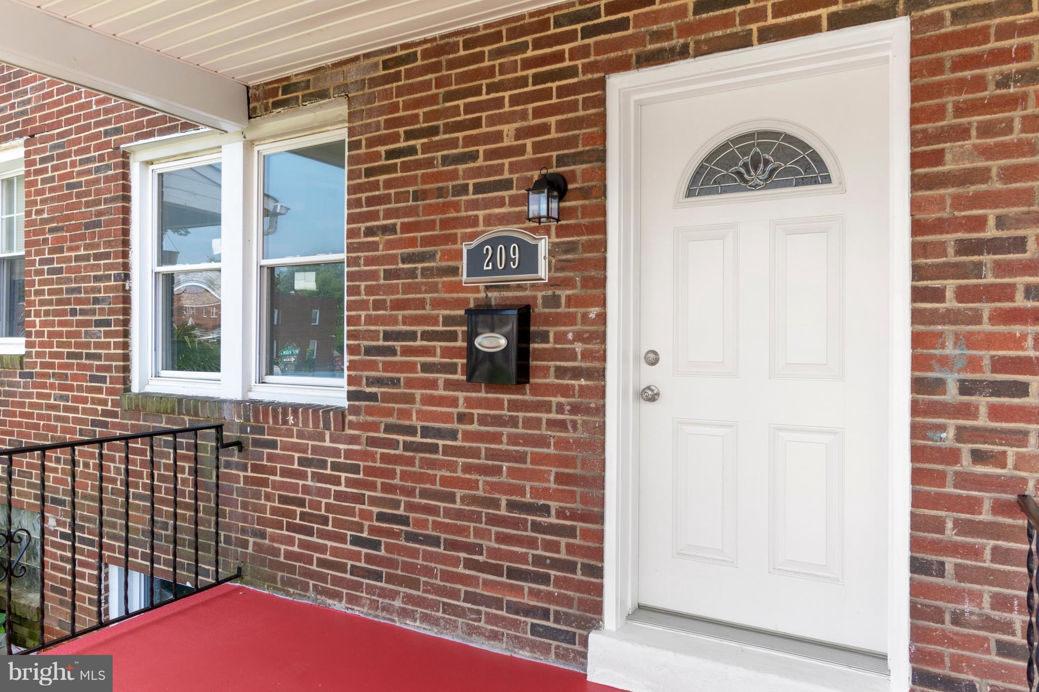 209 West Meadow Road Baltimore, MD 21225 - Photo 29 of 29 a view of a door of a brick building