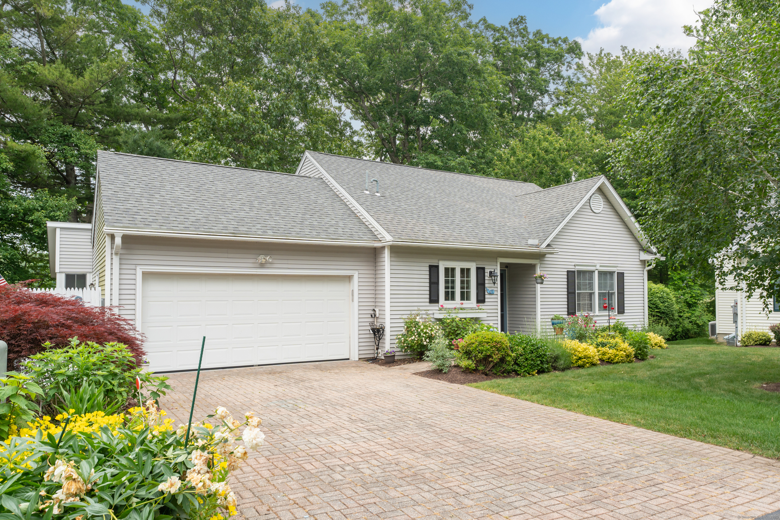 9 Sterling Drive, Unit 9 Clinton, CT 06413 - Photo 1 of 1 front view of house with a yard