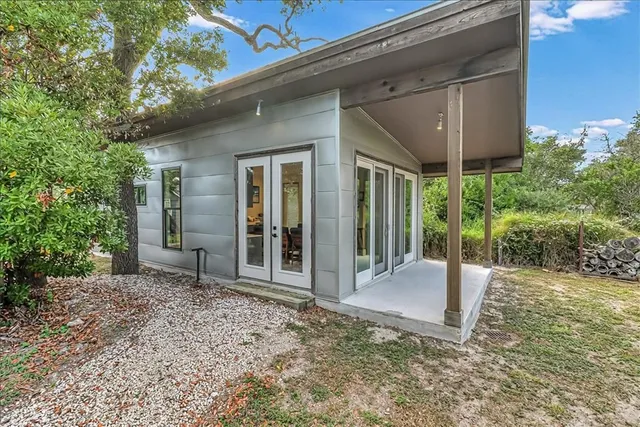 a view of a livingroom with furniture and staircase