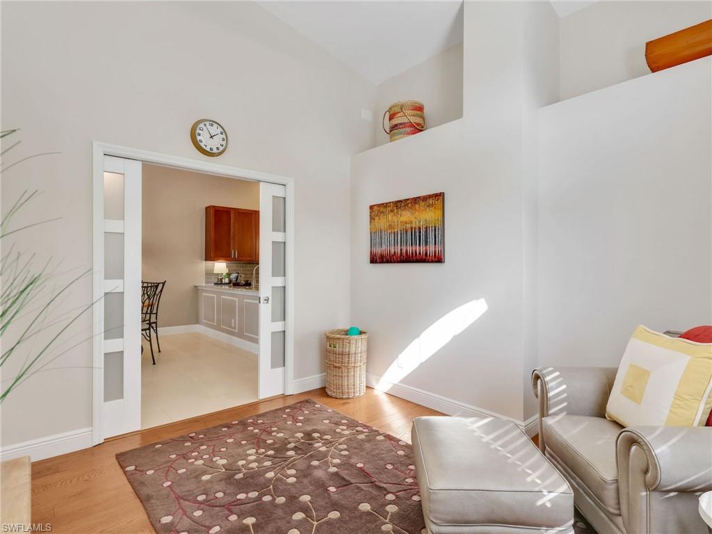 2214 Stacil Circle, Unit 27 Naples, FL 34109 - Photo 26 of 39 a living room with furniture and a rug