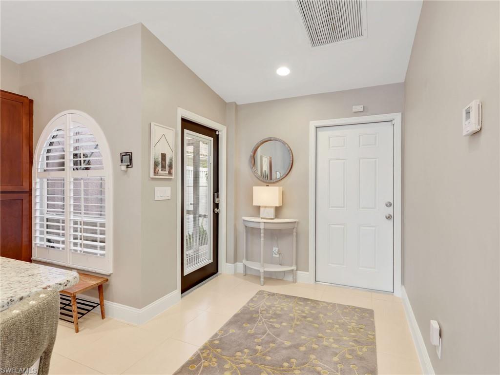 2214 Stacil Circle, Unit 27 Naples, FL 34109 - Photo 28 of 39 a view of livingroom with window