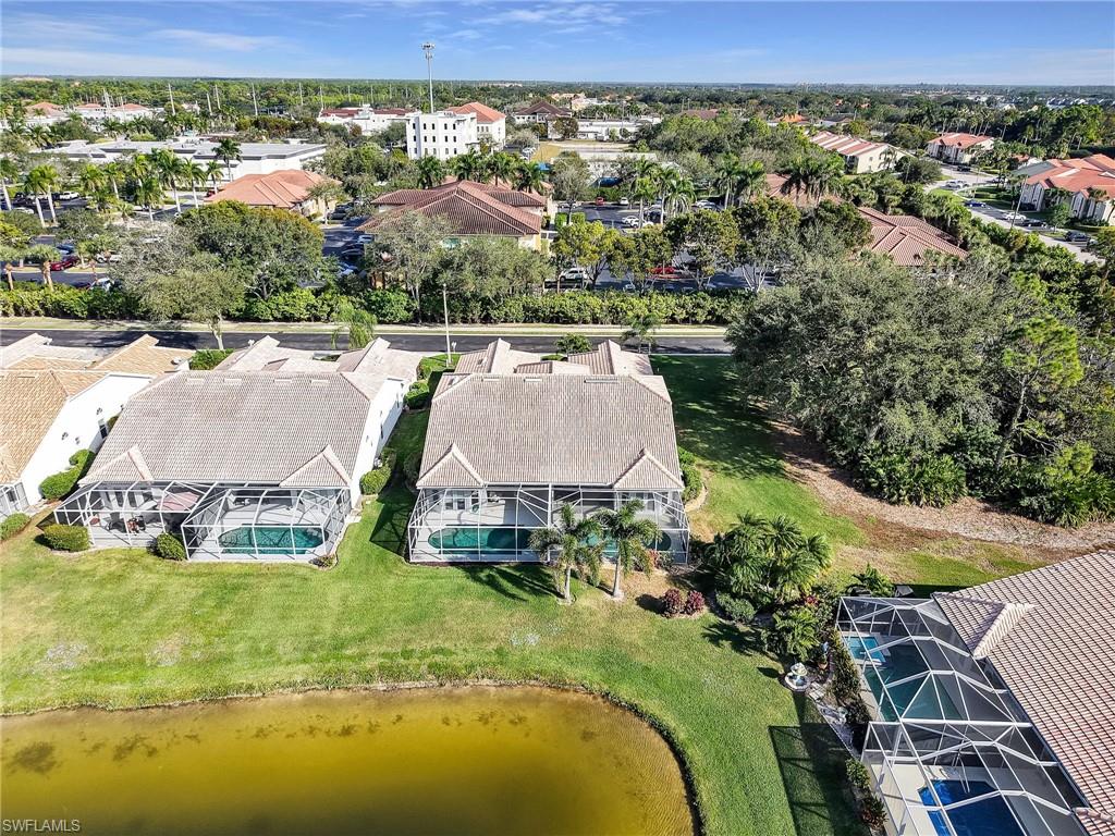 2214 Stacil Circle, Unit 27 Naples, FL 34109 - Photo 33 of 39 a view of swimming pool and mountain view