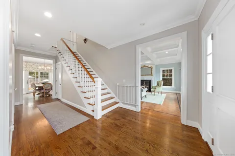 a view of an entryway with wooden floor and windows