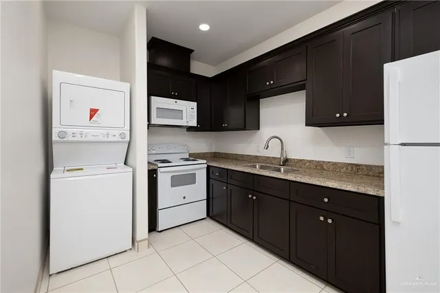 a kitchen with sink and cabinets