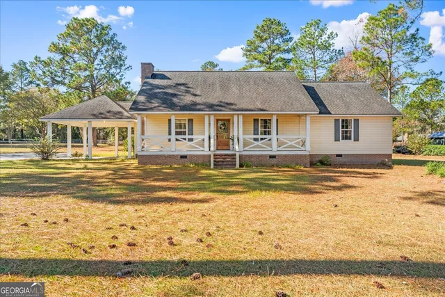 a view of the house with a ocean view