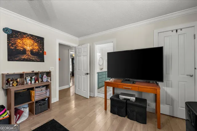 a room with furniture and flat screen tv