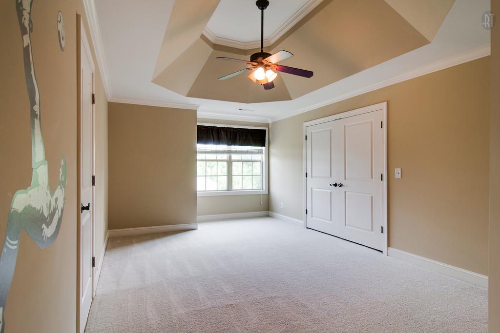 7307 Allans Ridge Lane Fairview, TN 37062 - Photo 21 of 30 Largest room upstairs has trey ceiling and also has access to unfinished storage space. All bedrooms in main house have lighted ceiling fans.