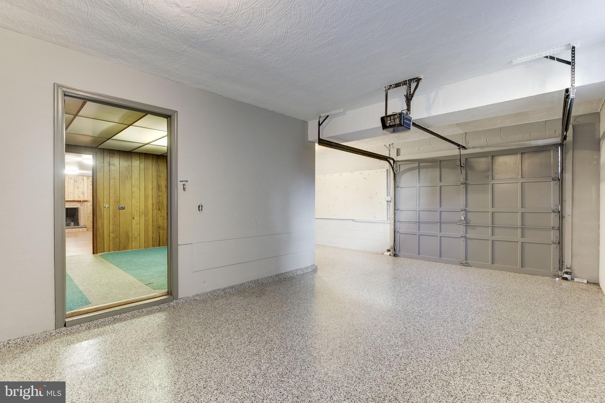 4709 River Road Bethesda, MD 20816 - Photo 42 of 52 Finished garage with polyurea flooring and storage