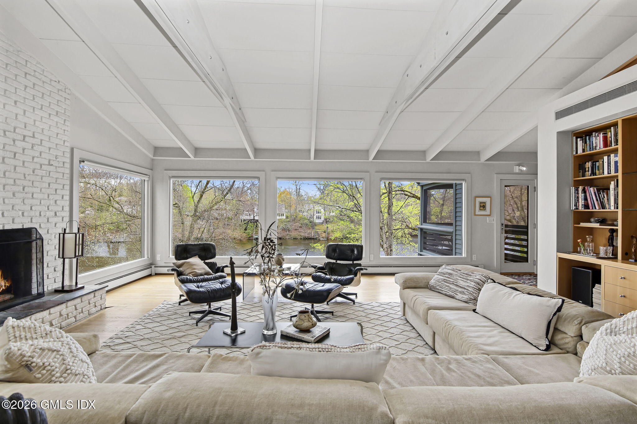 185 Valley Road Cos Cob, CT 06807 - Photo 7 of 38 a living room with furniture and a large window