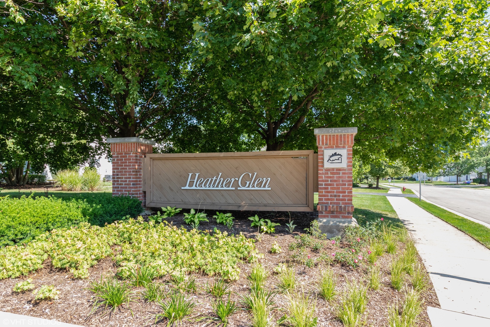 53 Braxton Lane, Unit 53 Aurora, IL 60504 - Photo 2 of 17 a sign on the side of the road