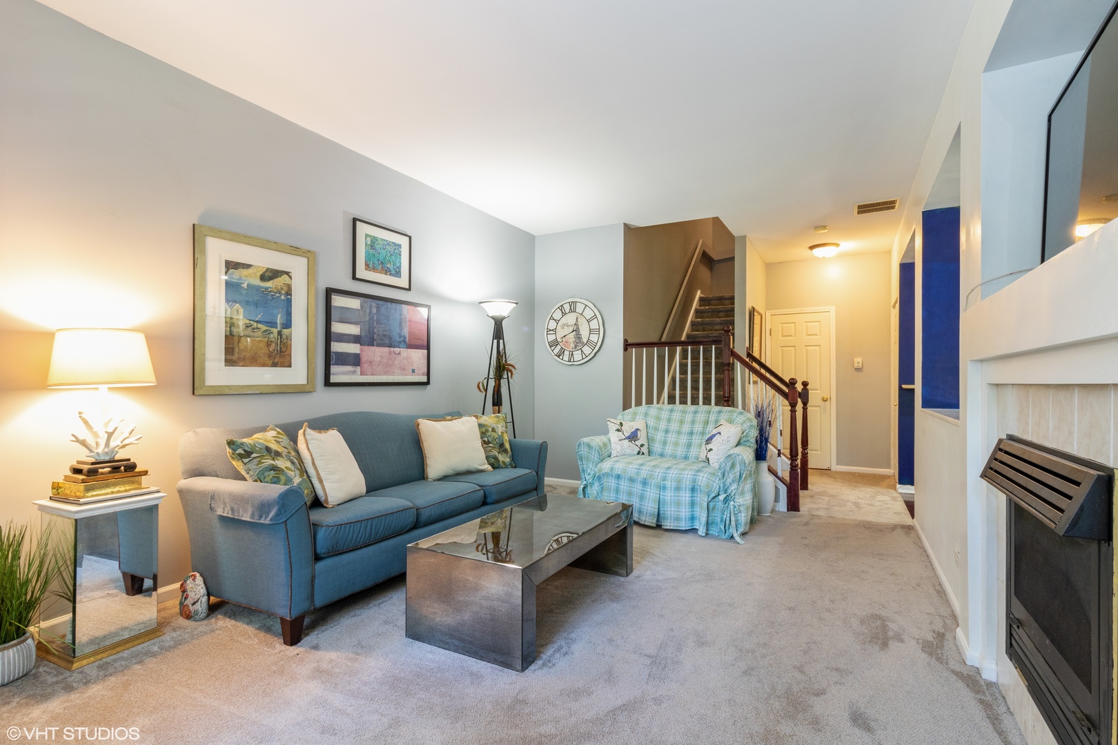 53 Braxton Lane, Unit 53 Aurora, IL 60504 - Photo 3 of 17 a living room with furniture and a flat screen tv