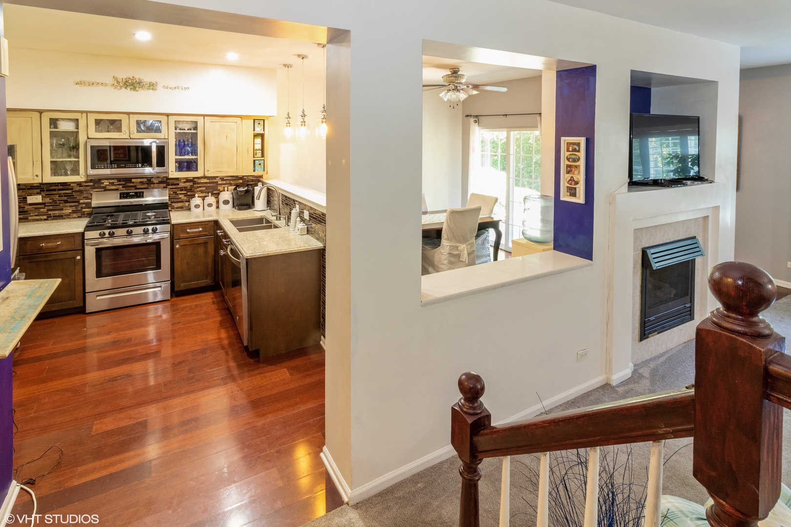 53 Braxton Lane, Unit 53 Aurora, IL 60504 - Photo 5 of 17 a kitchen with stainless steel appliances a stove a sink and a refrigerator