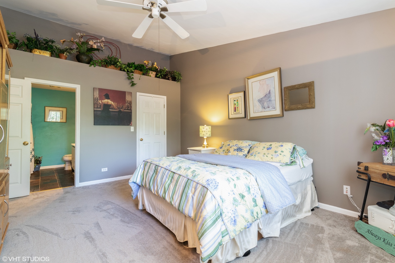 53 Braxton Lane, Unit 53 Aurora, IL 60504 - Photo 10 of 17 a bedroom with a bed and a chandelier