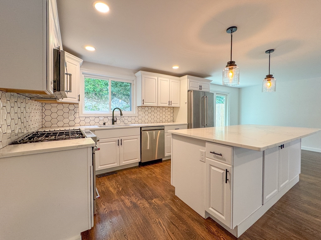 282 Pleasant Street Marblehead, MA 01945 - Photo 11 of 28 a kitchen with a sink window and cabinets
