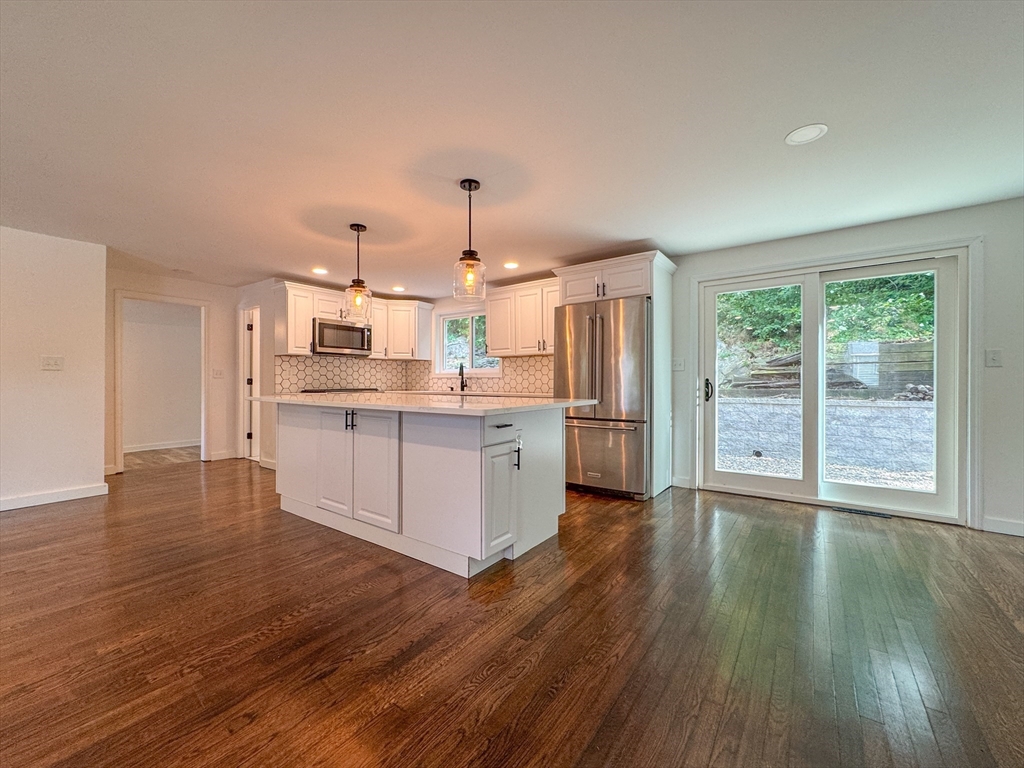282 Pleasant Street Marblehead, MA 01945 - Photo 12 of 28 a kitchen with stainless steel appliances a stove top oven and cabinets