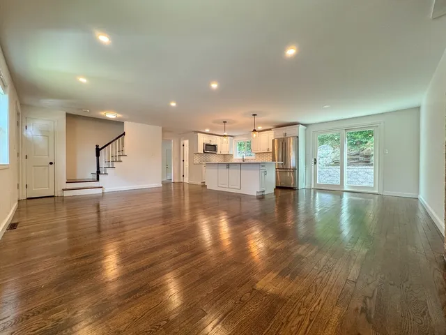 a view of a kitchen with a sink and microwave