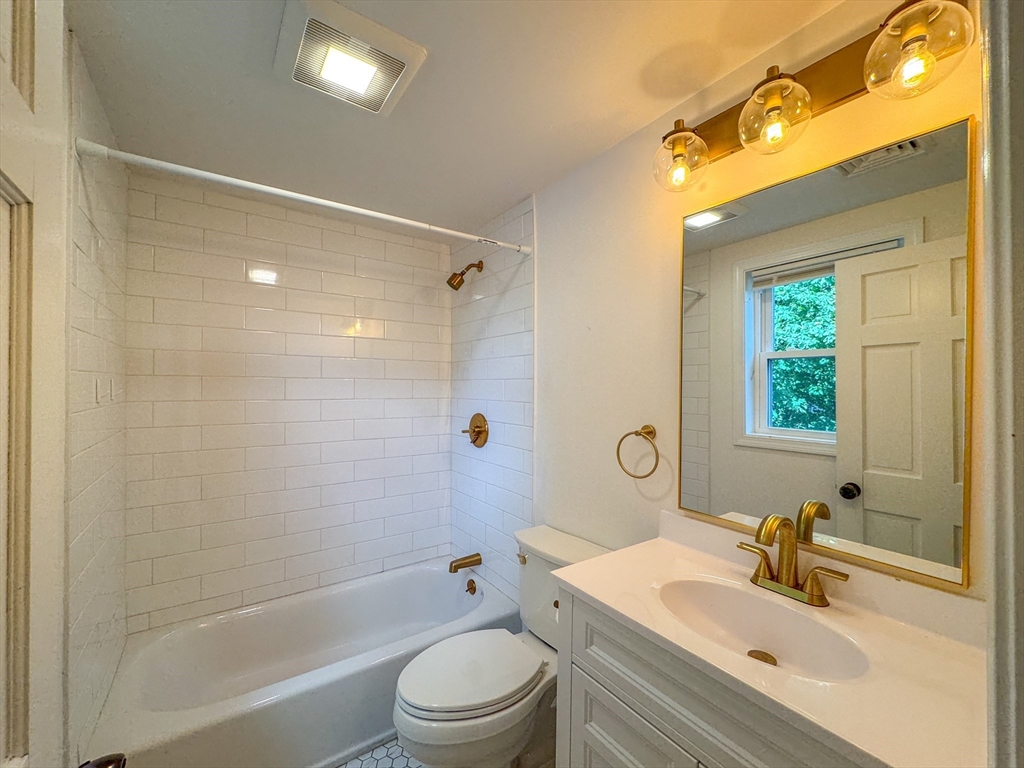 282 Pleasant Street Marblehead, MA 01945 - Photo 21 of 28 a bathroom with a sink a toilet and shower