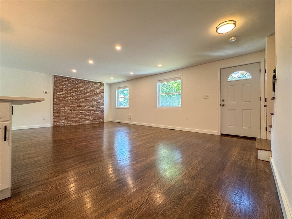 282 Pleasant Street Marblehead, MA 01945 - Photo 25 of 28 an empty room with wooden floor and windows