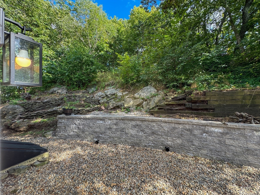 282 Pleasant Street Marblehead, MA 01945 - Photo 27 of 28 a view of a yard with plants and trees
