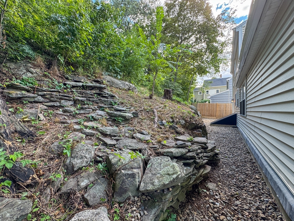 282 Pleasant Street Marblehead, MA 01945 - Photo 3 of 28 a view of a yard with plants and large trees