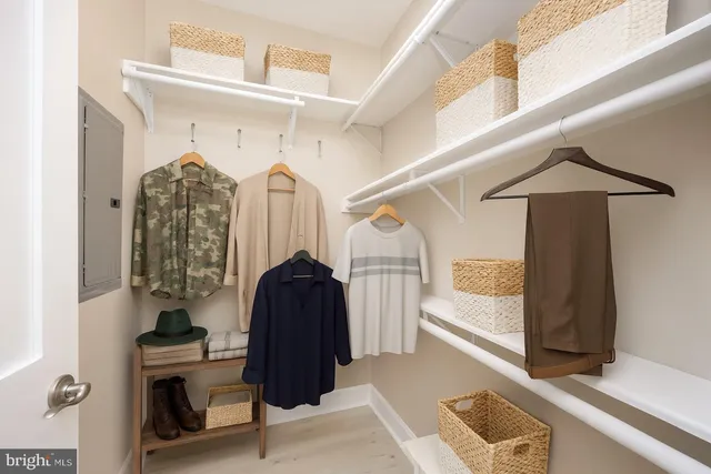 a view of living room with furniture and a chandelier