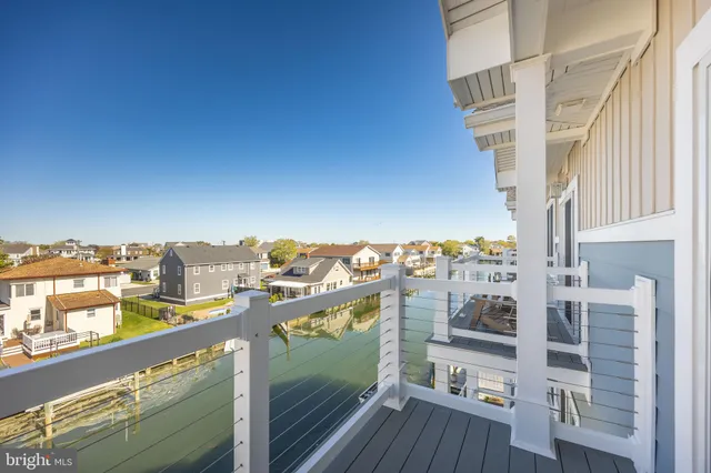 a view of a balcony with wooden floor