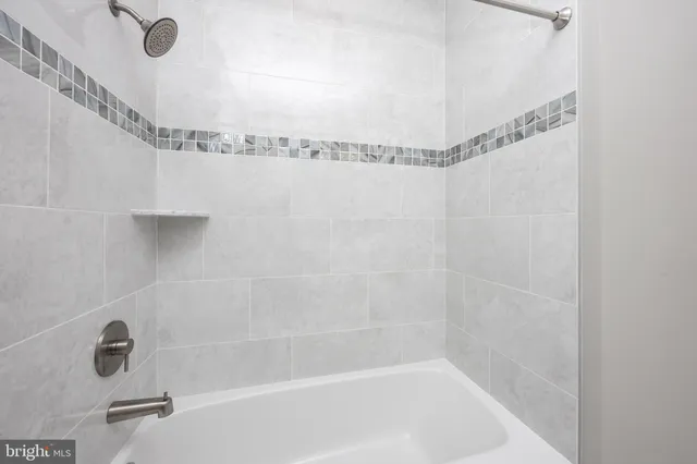 a bathroom with a shower and a shower