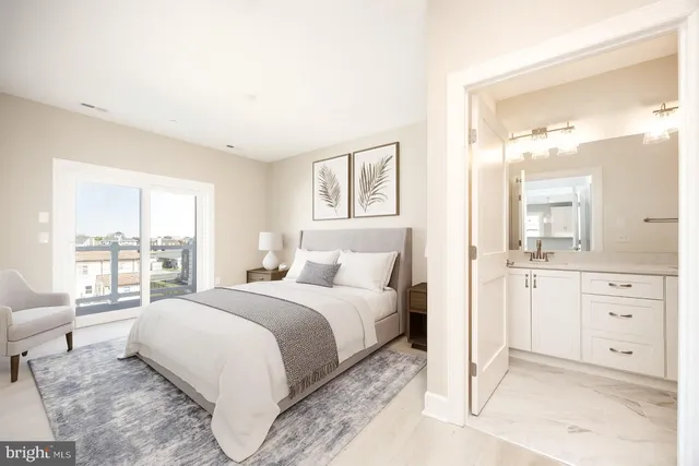 a spacious bedroom with a large bed and a window