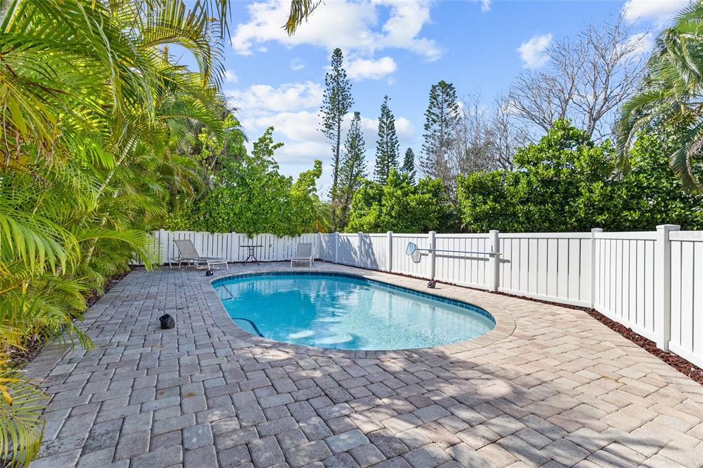 315 Spring Avenue Anna Maria, FL 34216 - Photo 41 of 63 a swimming pool with outdoor seating and plants