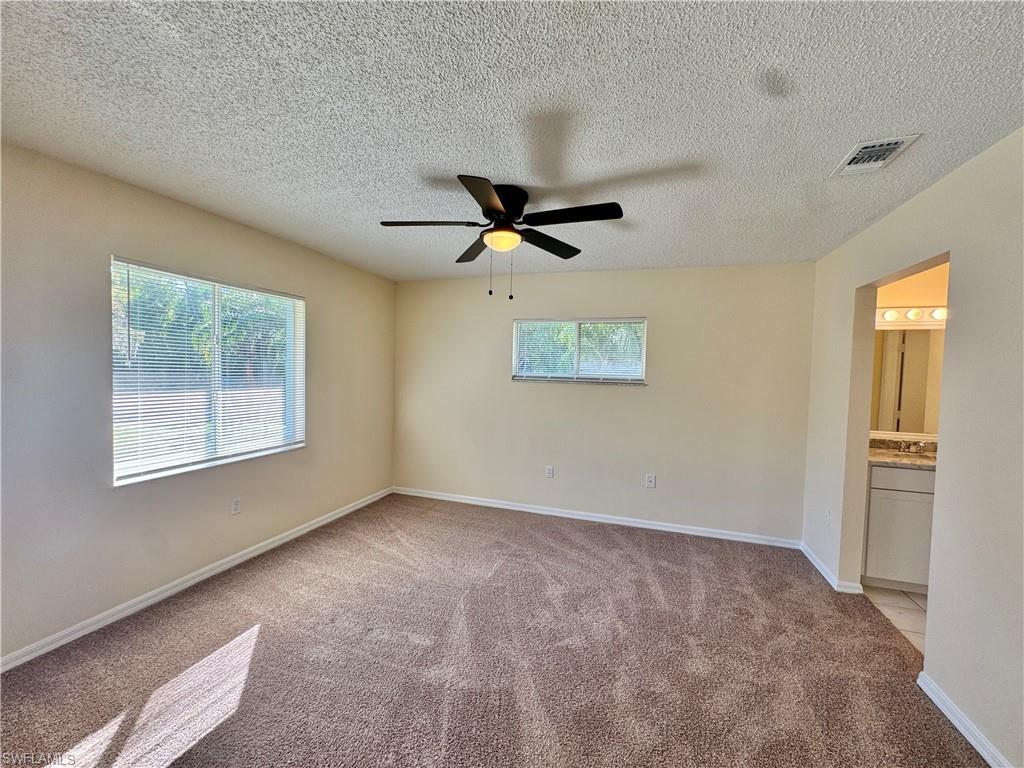 5665 Whitaker Road, Unit A201 Naples, FL 34112 - Photo 14 of 30 a view of an empty room with a window