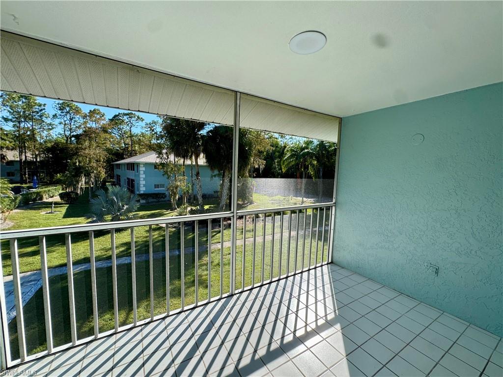 5665 Whitaker Road, Unit A201 Naples, FL 34112 - Photo 20 of 30 a view of a balcony