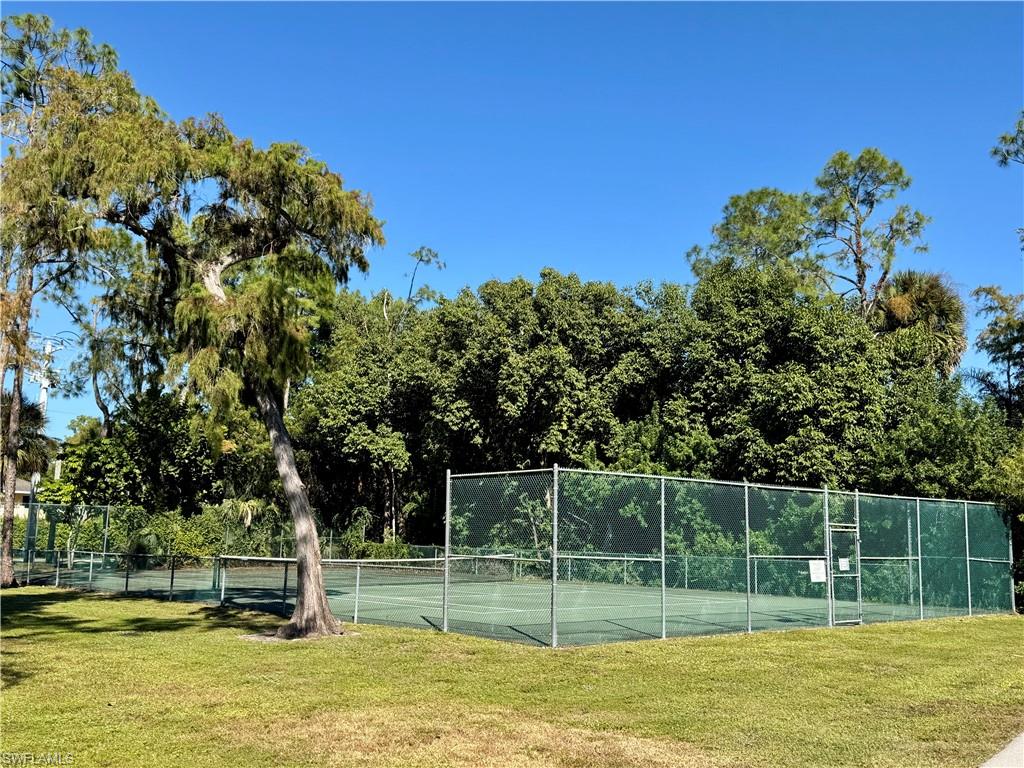 5665 Whitaker Road, Unit A201 Naples, FL 34112 - Photo 28 of 30 a view of a park with large trees